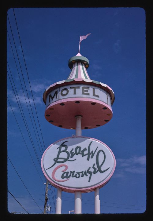 A 1985 photograph showing the original Beach Carousel road sign.